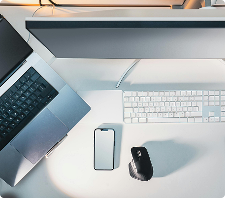 Workspace with laptop and phone